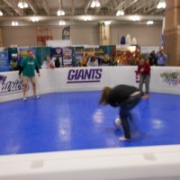 Kid and adult campers alike play a game of Ga-Ga Ball!